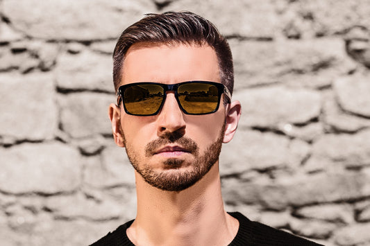 a young man in the picture wearing clip-on sunglasses